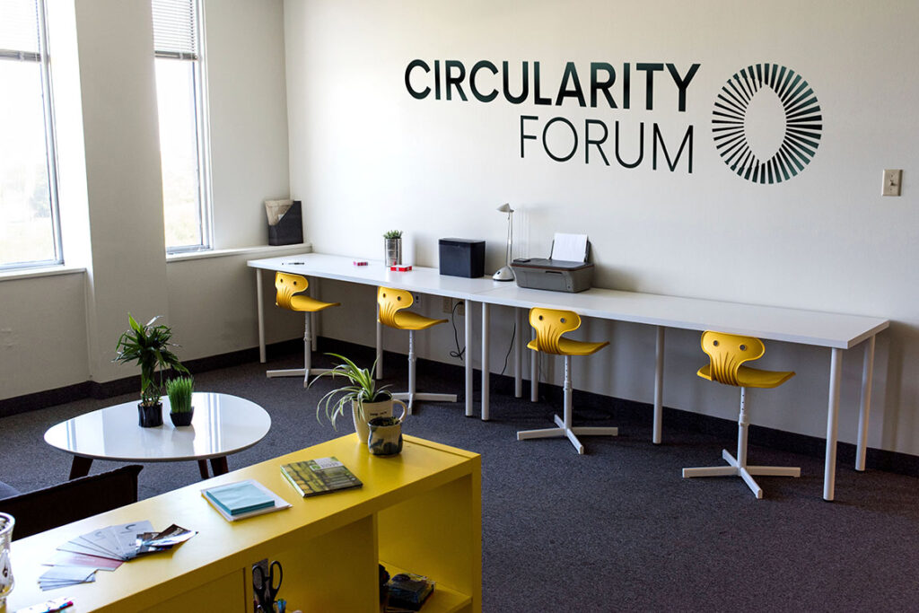 photograph of conference room, graphic in center reads "Circularity Forum"