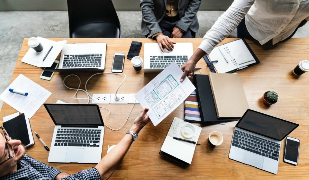 topside view of people working collaboratively at a desk