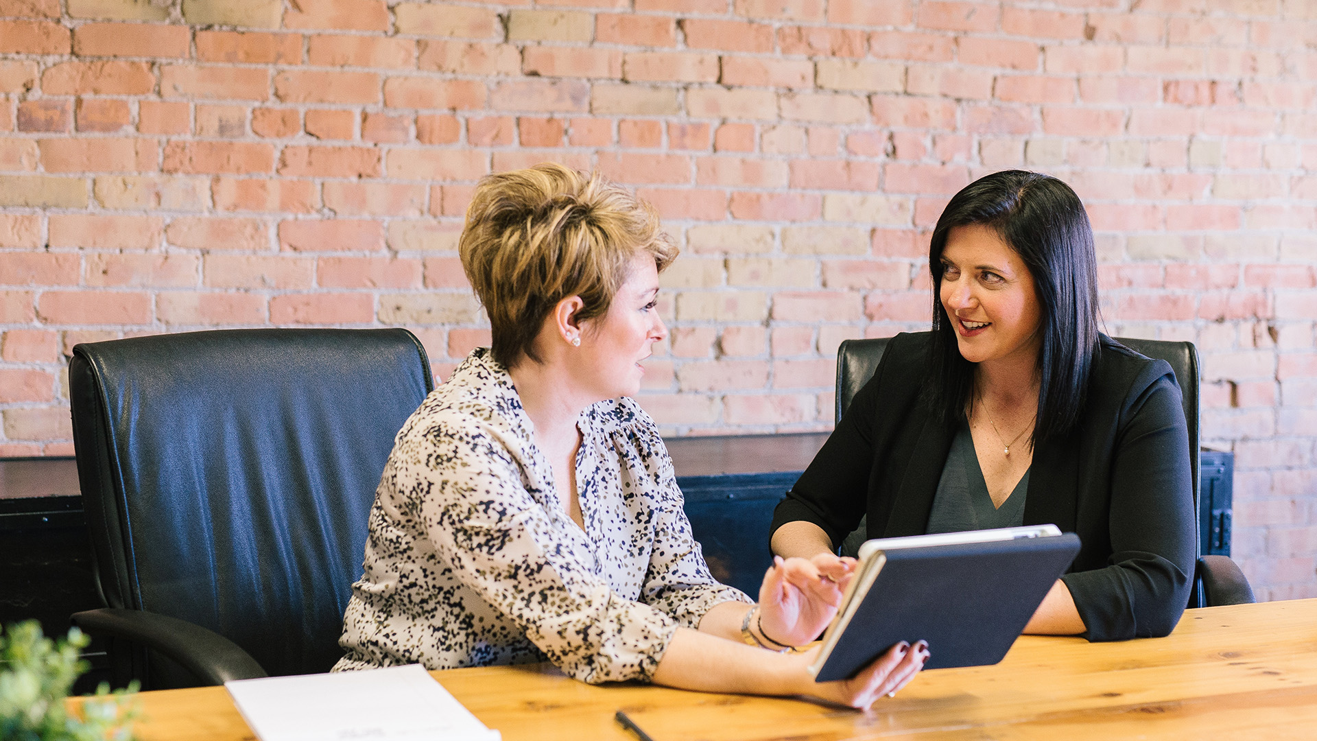 Two women discussing CSR strategy